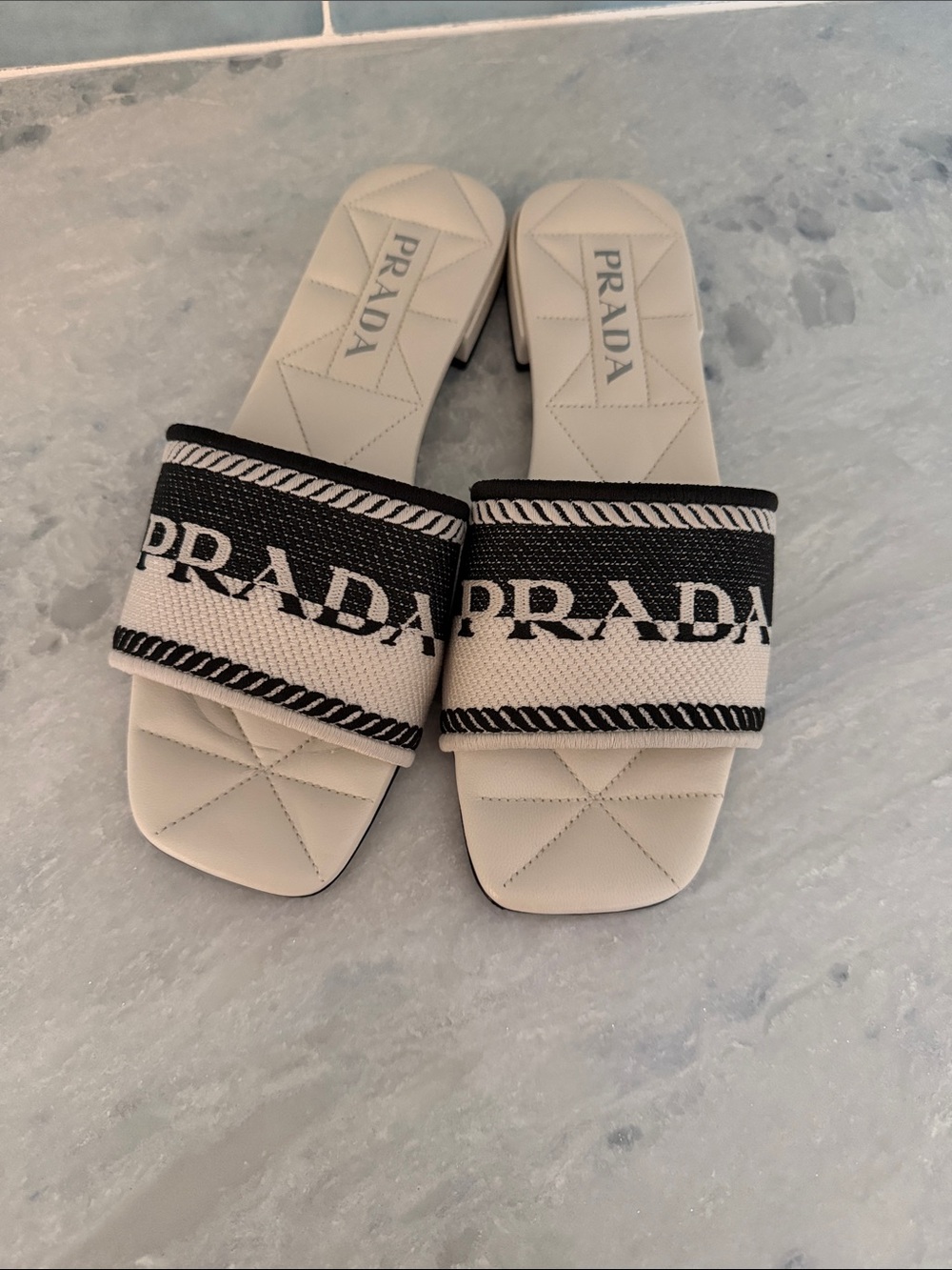 Prada Cream Slide Sandals with Black Logo Strap